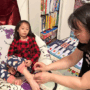 P-B10-W96-04-A-mom-putting-a-band-aid-on-her-daughter’s-foot