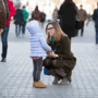 P-B10-W98-02-A-child-with-a-parent-in-a-crowded-place