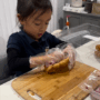 P-B10-W99-06-Girl-preparing-a-sandwich